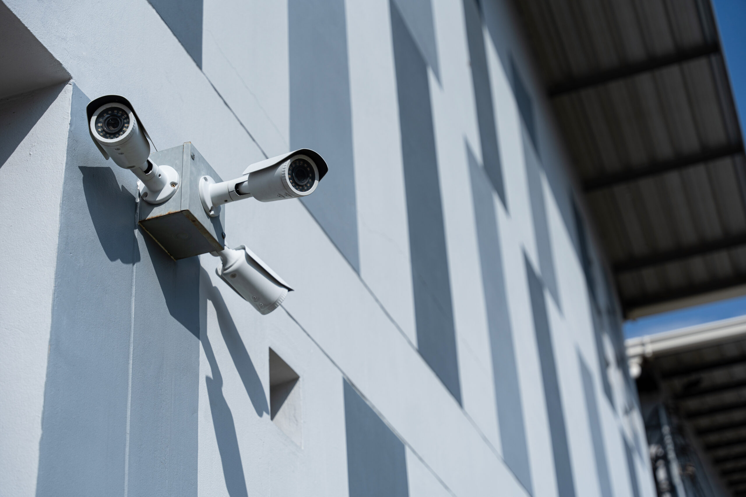 Security surveillance camera in front of office building. CCTV, Closed-circuit television security.