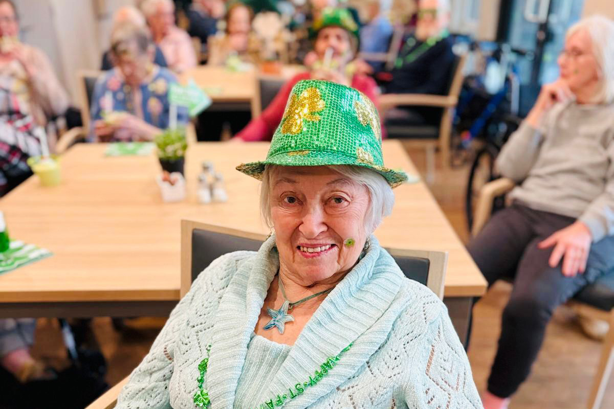 Senior residents enjoying live entertainment and holiday celebration at Bayview Seniors Community