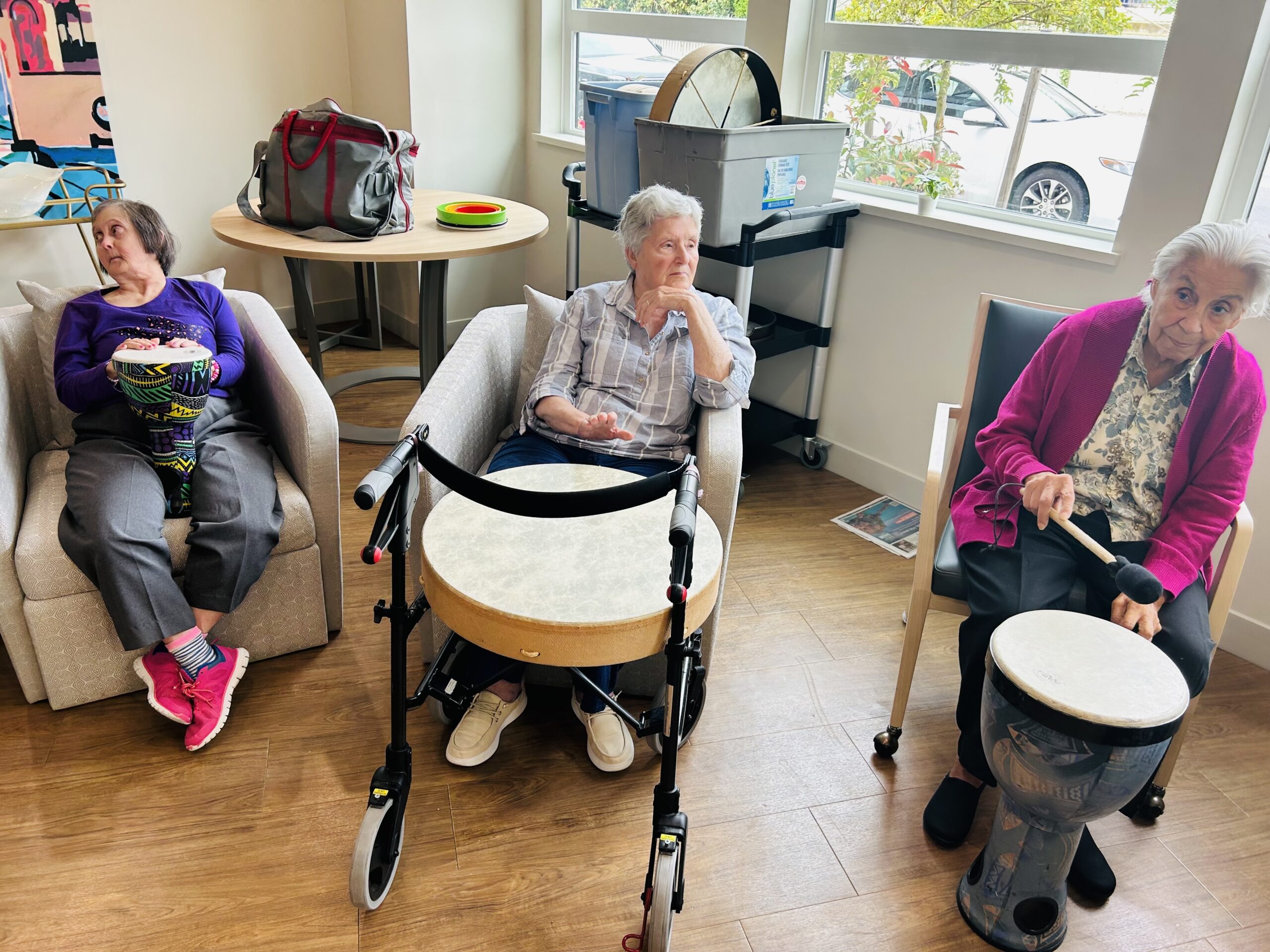 Bayview Seniors Community residents participating in a group drum circle activity in White Rock