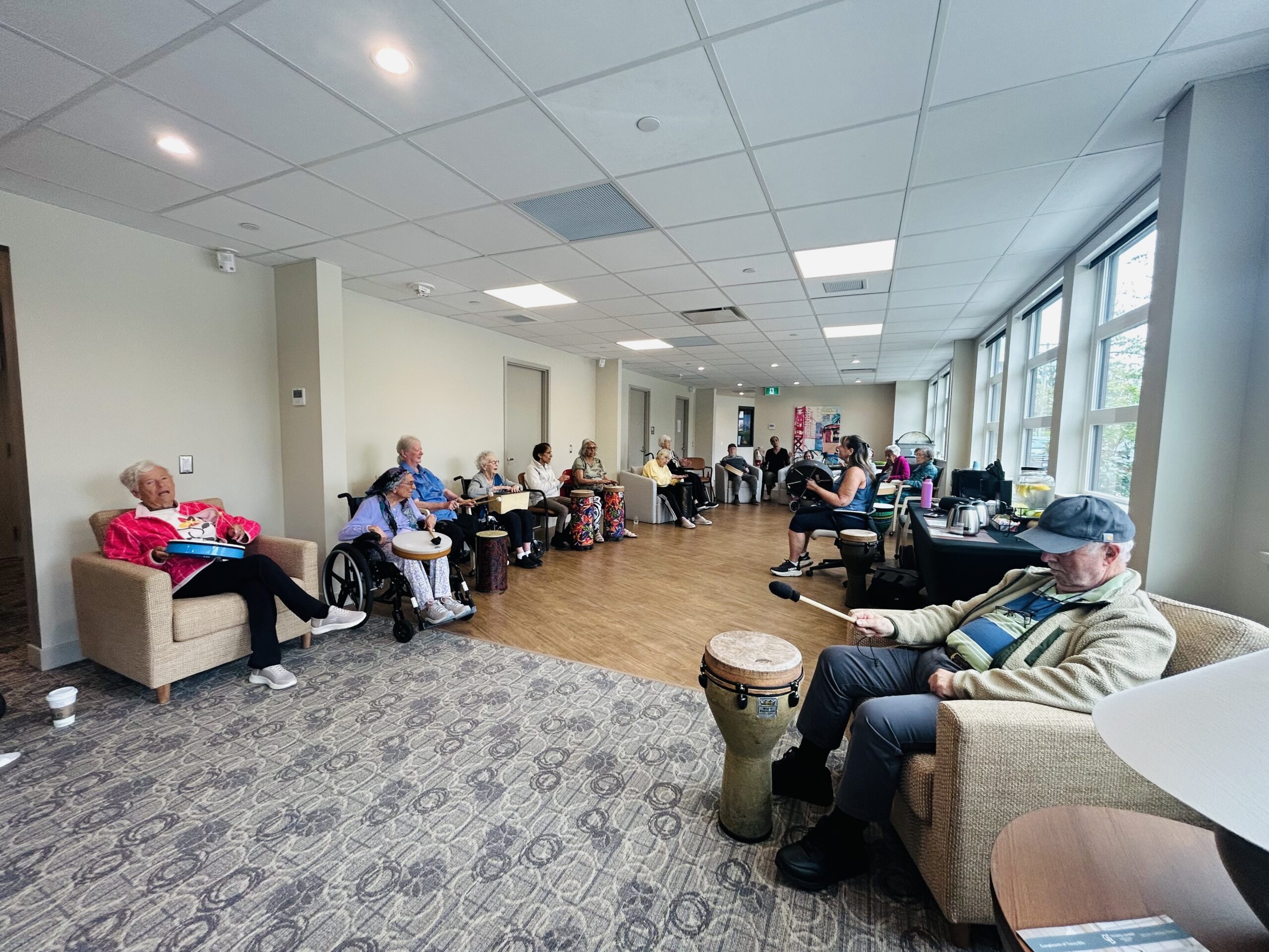Bayview Seniors Community residents participating in a group drum circle activity in White Rock